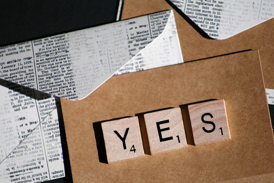 Scrabble tiles showing Yes